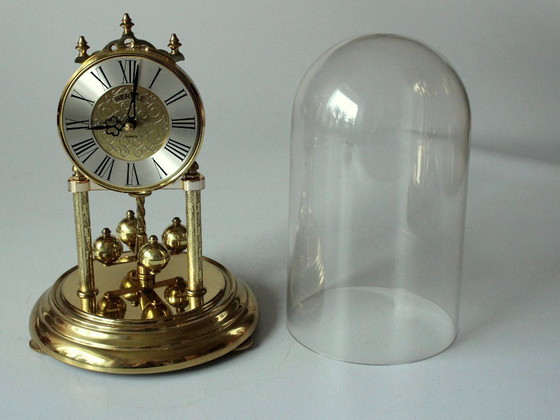 Image 1 of Elegant Hermle brass torsion pendulum clock with glass dome - Vintage