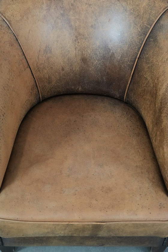 Image 1 of Timeless vintage sheepskin club armchair with character and a beautiful patina