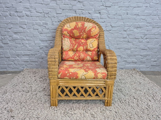 Luxurious Vintage Bamboo & Rattan Armchair with Floral Cushions – Warm Terracotta Tones