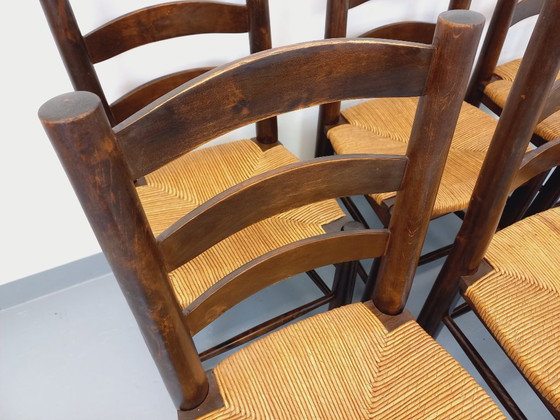 Image 1 of Set van 6 vintage brutalistische stoelen van Georges Robert, gemaakt van hout en stro, uit de jaren 50 en 60.