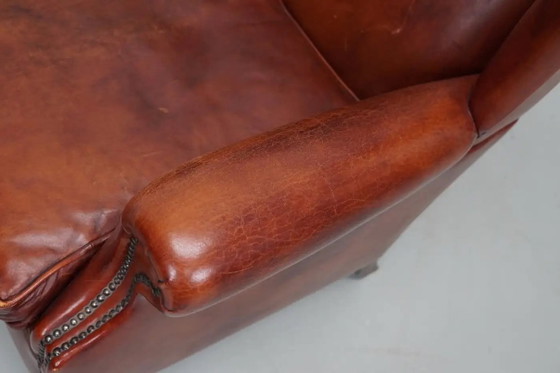 Image 1 of Vintage Nederlandse cognackleurige leren clubfauteuil met vleugelrug