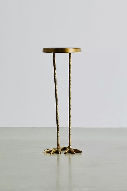 Gold metal side table with bird shape and two bird feet