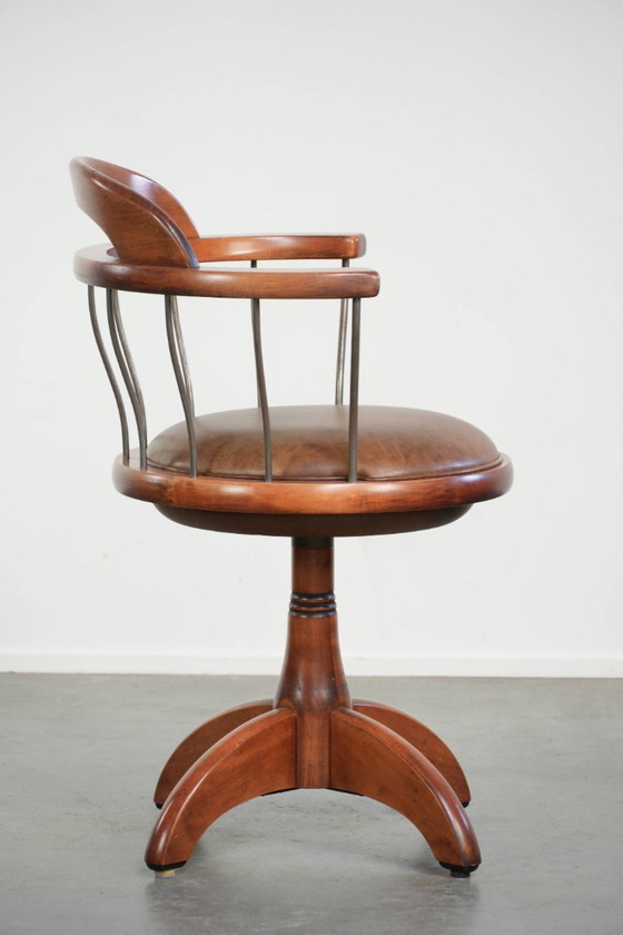 Image 1 of Draaibare Schuitema stoel/ bijzetstoel/ bureaustoel met een cognac kleurige rundleren zitting