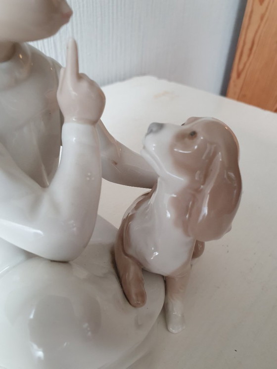Image 1 of Authentic Lladro "Boy with dog" - porcelain figurine 20 cm