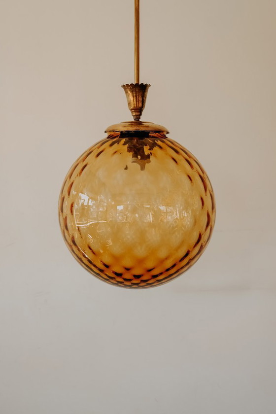 Brass Pendant Lamp with Round Orange Glass Shade and Swirl Structure (photo 3 of 8)
