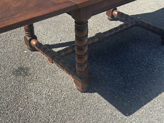 Image 1 of Table en chêne massif à rallonges, pieds tournés XIX e siècle 