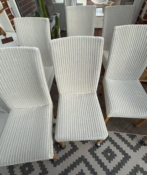 Image 1 of 8 originele Lloyd LOOM stoelen, eetkamerstoelen, ook in kleinere aantallen verkrijgbaar, houten frame, wit riet.