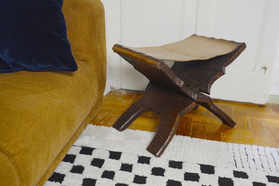 Image 1 of Brutalist Folding Stool Leather Sling Seat Hand Carved Wood X Frame 1950s Rustic Mid Century Ottoman