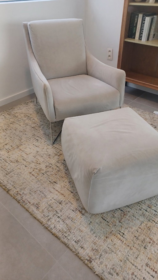Natuzzi armchair with footstool