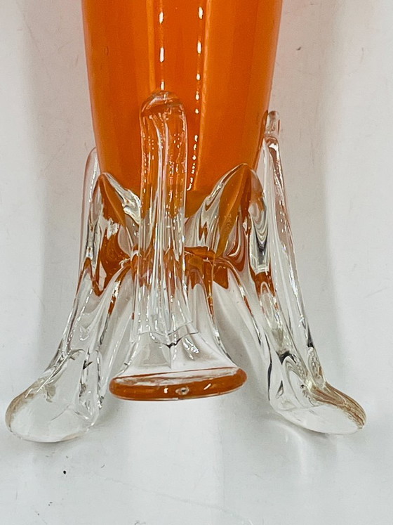 Image 1 of Vintage orange glass bud vase with a sculpted base