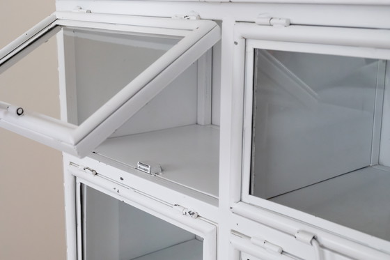 Image 1 of Vetrina vintage in metallo con 9 ante a ribalta in vetro.