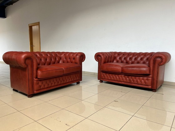 Image 1 of English Chesterfield Sofa Pair – Paprika Red Leather (Fully Restored, Rare Colour)