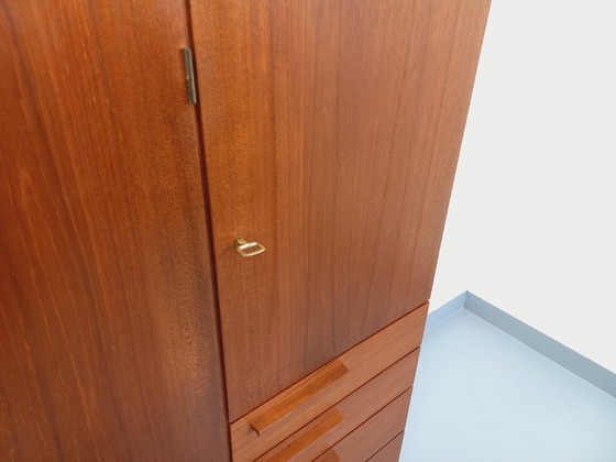 Image 1 of Tall, modernist, vintage Scandinavian sideboard in teak and black metal from the 1960s