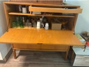 Wooden liquor cabinet with flap door, light brown