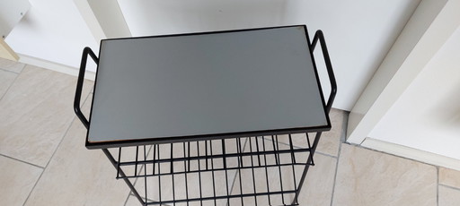 Vintage dubbele lectuurrek van zwart metaal met formica blad