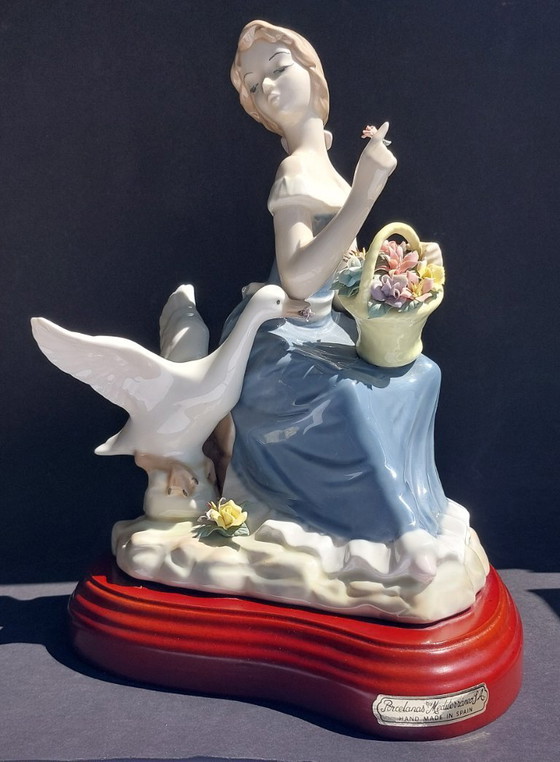 Image 1 of Large porcelain figurine: Lady with a goose and basket of flowers