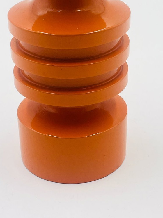 Image 1 of Oranje houten kandelaar uit de jaren zeventig