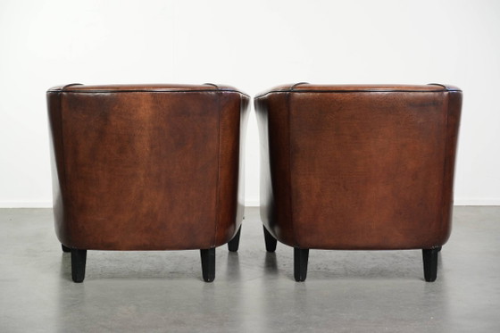 Image 1 of 2x schapenleren Art Deco design clubfauteuil met een mooi patina, zwarte biezen en mooie kleuren