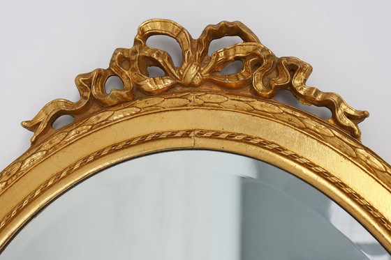 Image 1 of Oval shaped carved gilded Baroque mirror with beveled glass, Belgium  