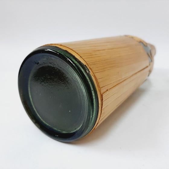 Image 1 of Vintage glazen fles omwikkeld met riet