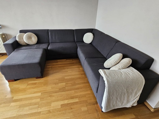 Dunkelgrau/anthrazitfarbenes Ecksofa mit Hocker - Loods 5