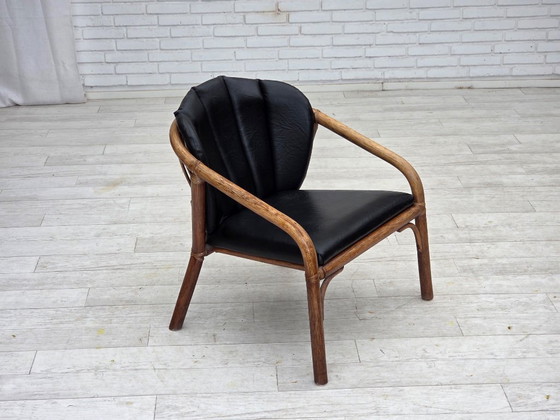 Image 1 of 1970s, Danish armchair, rattan, black artificial leather.