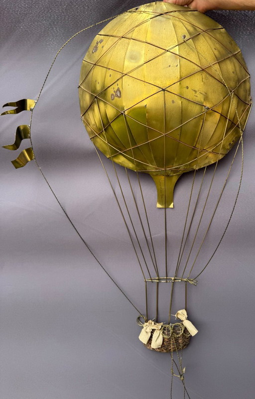 The brass hot air balloon wall sculpture by Daniel D' Haeseleer