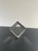 Tilted glass cube with prismatic effect