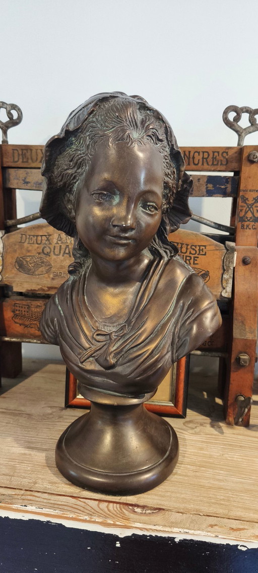 Old statue, Bust of a French girl, a peasant woman in a bonnet.