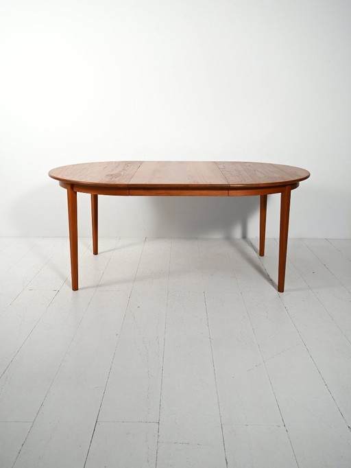 Round extendable teak table by Svante Skogh