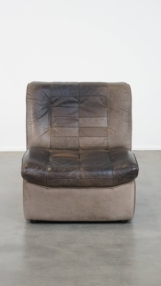 Fauteuil design en cuir vintage gris