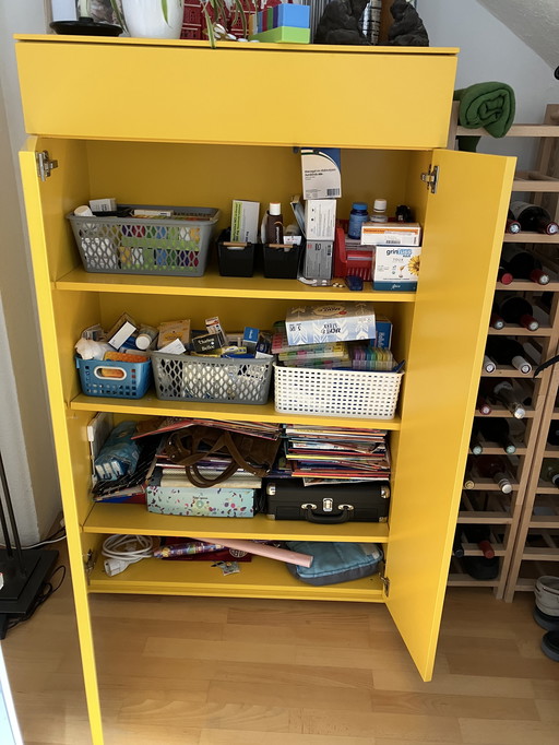 Design cabinet in cheerful yellow color