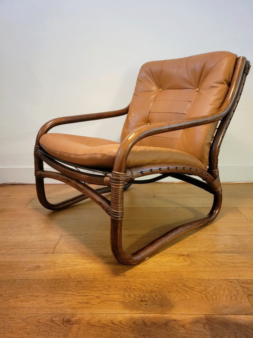 Sillón vintage de ratán con cojines de cuero de 1970