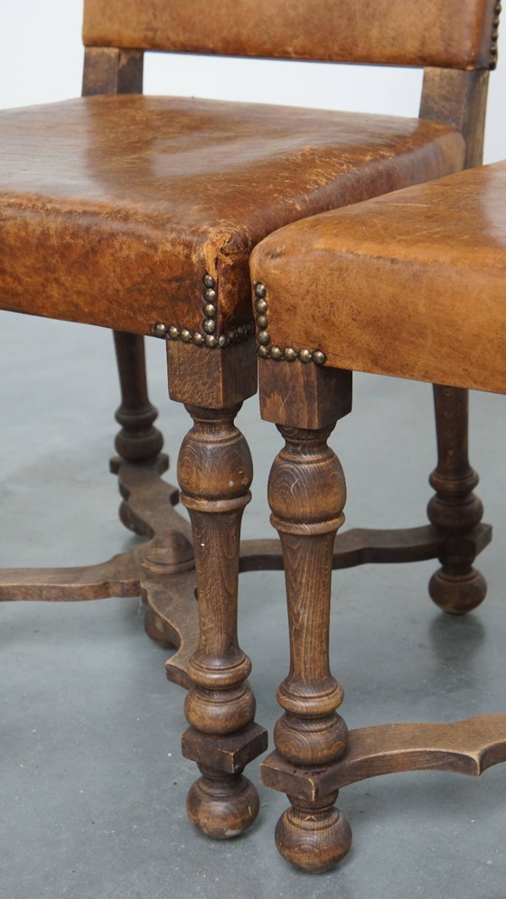 Image 1 of Satz von 2 antiken Esszimmerstühlen aus Holz und Schafsleder aus den frühen 1900er Jahren