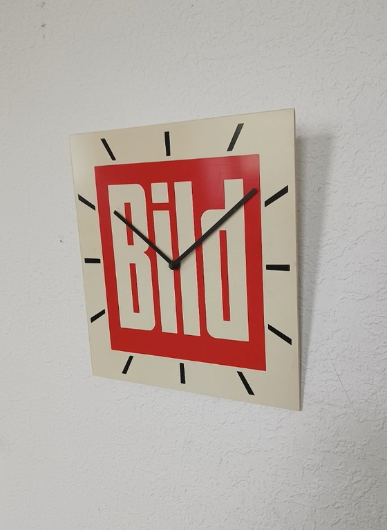 Image 1 of 1970s wall clock with advertising