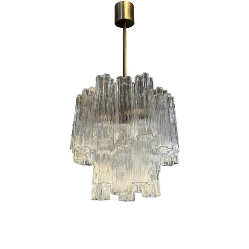Lampadario di lusso Tronchi con struttura in metallo brunito e vetro di Murano.