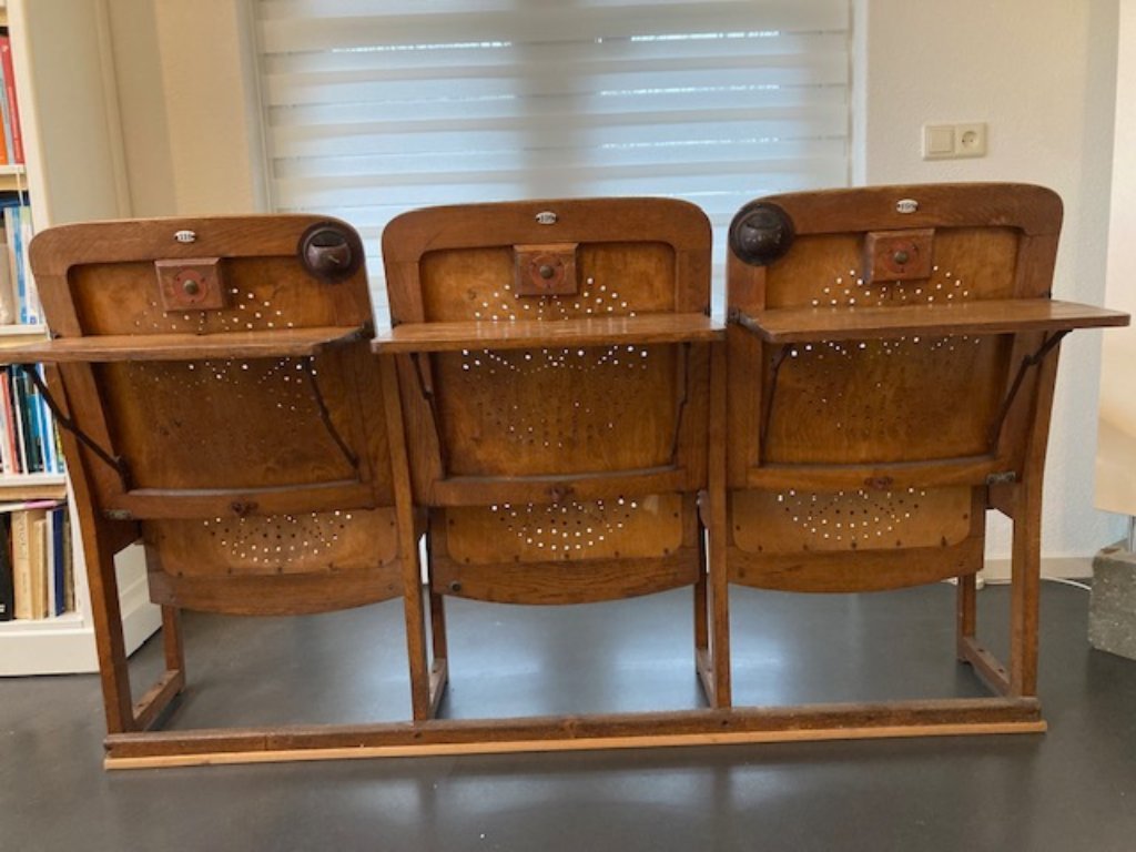 3 auction chairs with folding table on the back