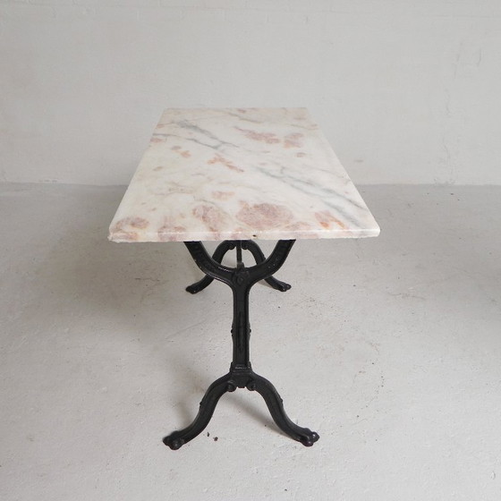 Image 1 of Table de bistrot avec plateau en marbre sur piètement en fonte, PARIS, années 1930