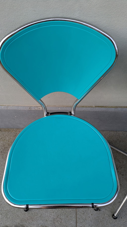 Set mit 4 türkisfarbenen Ikea Isak Klappstühlen