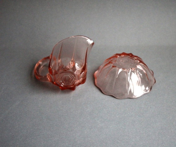Image 1 of Art Deco Rosalinglas pressed glass pink milk sugar set with floral motif on the bottom