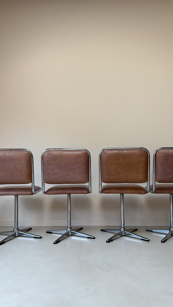 Image 1 of Four vintage chrome swivel chairs with faux leather