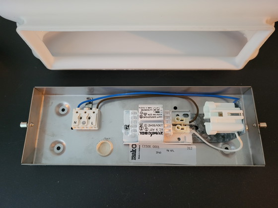 Image 1 of 3 RAAK (bathroom) wall lamps with opaline glass shade and stainless steel frame.