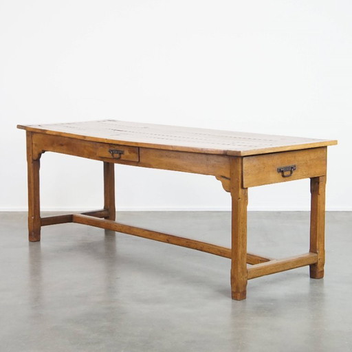 Large antique French farmhouse dining table made of fruitwood from the late 18th century with beautiful and original details.