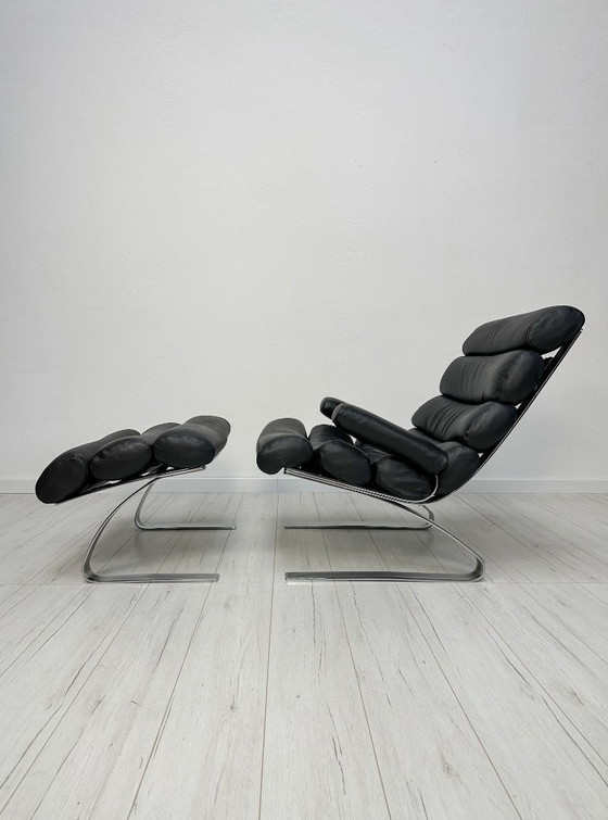 Image 1 of COR Sinus loungestoel en poef in zwart leer van Reinhold Adolf & Hans-Jürgen Schröpfer – Designicoon uit de jaren 70
