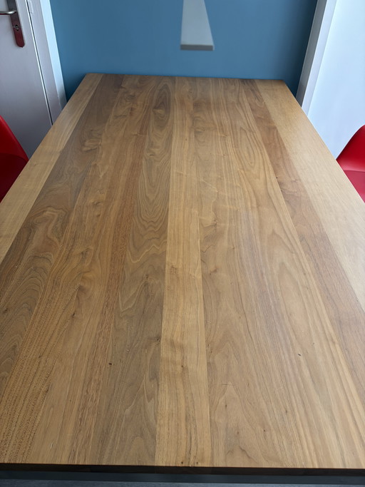 Dining table by Bert Plantagie, model Bridge nutcracker, with stainless steel base 180cm x 100cm, leg width 10cm x 4cm