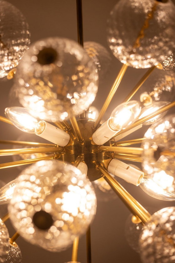 Image 1 of Kamenicky Senov, editor. Pair of brass and glass chandeliers. Circa 1970