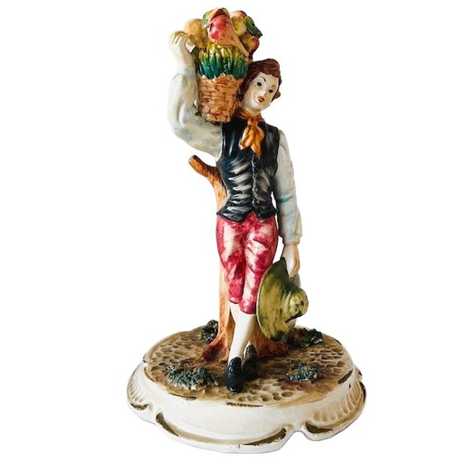 Vintage mid-century Italian Bassano sculpture of a young man with fruit, 1950s, signed