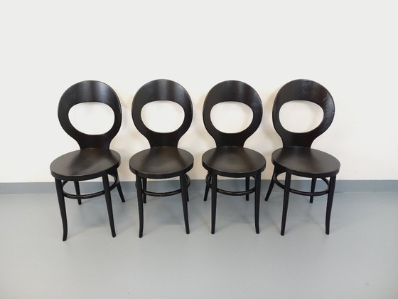 Image 1 of Set van 4 vintage Baumann Mouette stoelen in zwart hout uit de jaren 70.