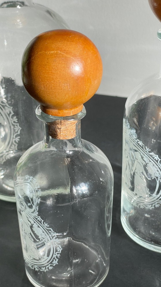Image 1 of Vintage Engraved Glass and Wood Bottles