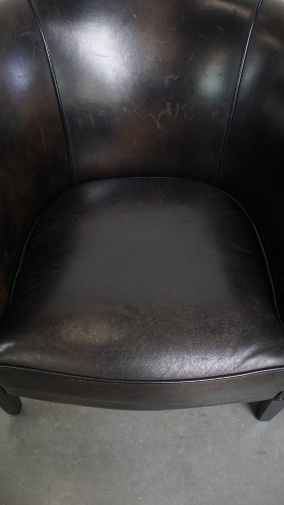 Image 1 of  Set van 2 subtiele zwart/ grijze schapenleren clubfauteuils 